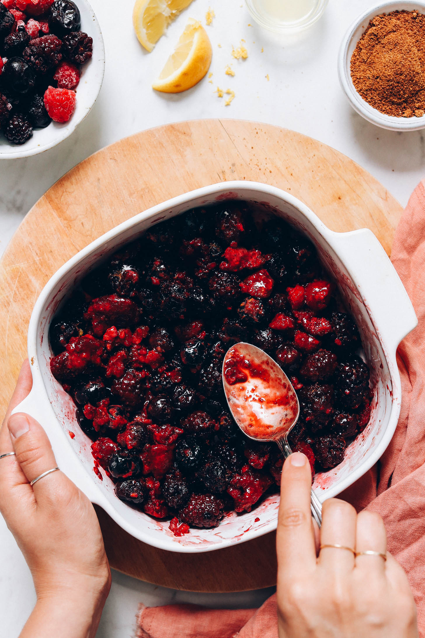 Spoon in a baking dish of mixed berries