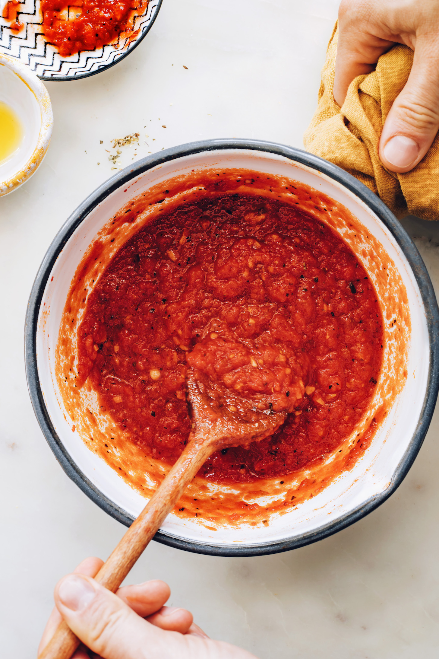 Cooking our easy pizza sauce recipe in a saucepan