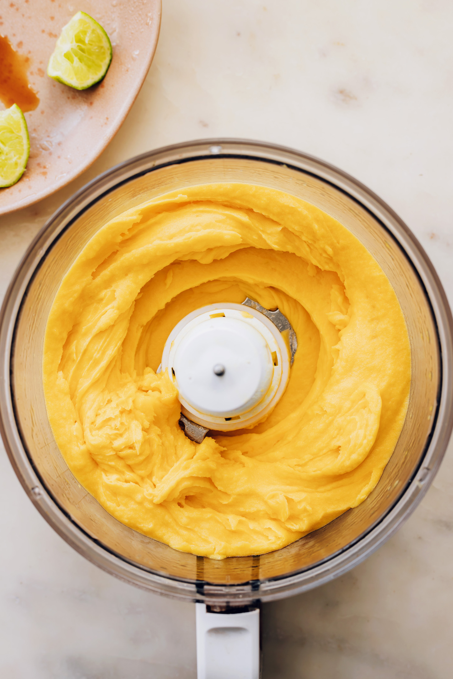 Creamy mango sorbet in a food processor