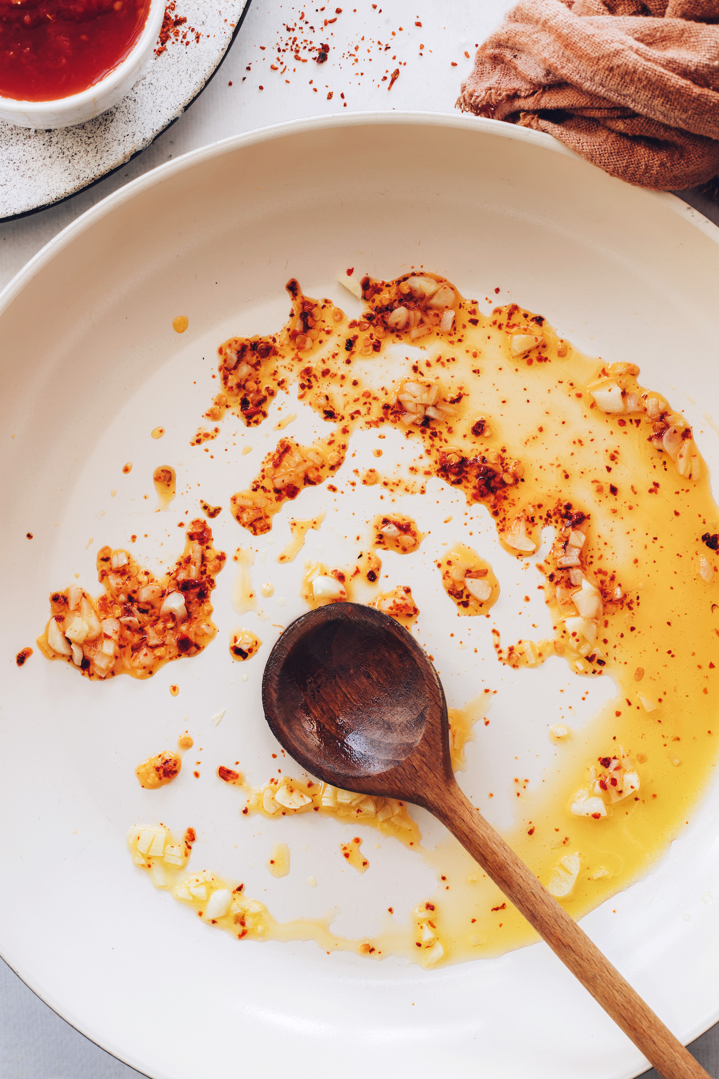 Sautéing garlic and red pepper flakes in olive oil
