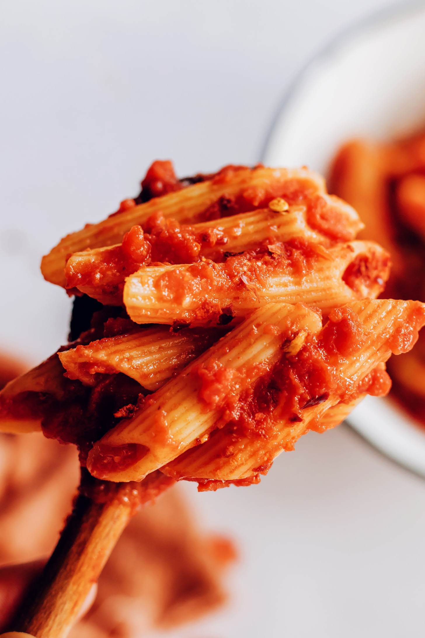 Close up shot of a bite of pasta arrabbiata
