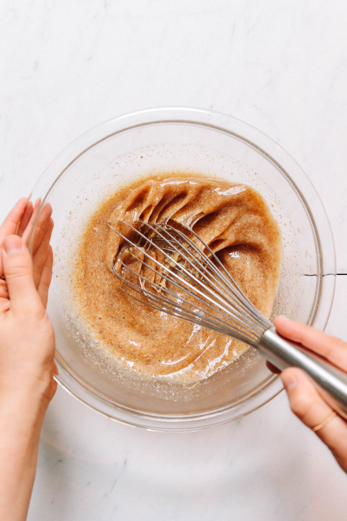 Whisking flax eggs in a mixing bowl