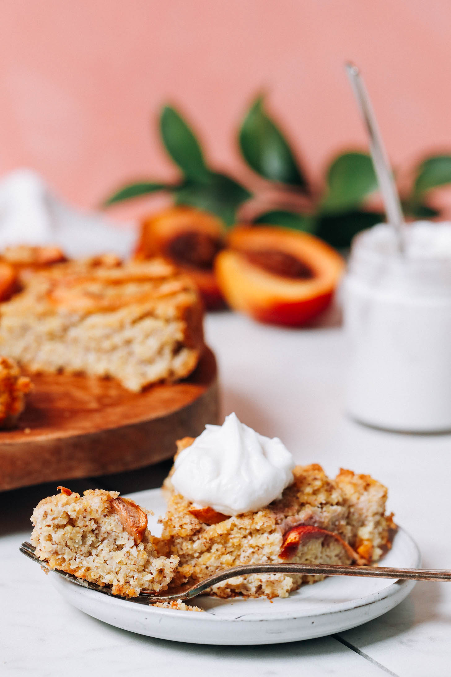 Plate of millet breakfast cake topped with coconut yogurt