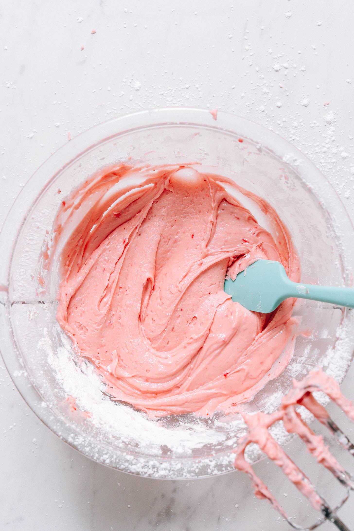 Bowl of vegan strawberry frosting
