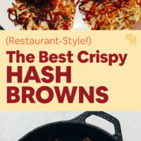 A cast-iron pan with crispy hash browns in it with ketchup