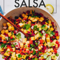 Bowl of easy vegan and gluten-free mango salsa with fresh mango and cilantro