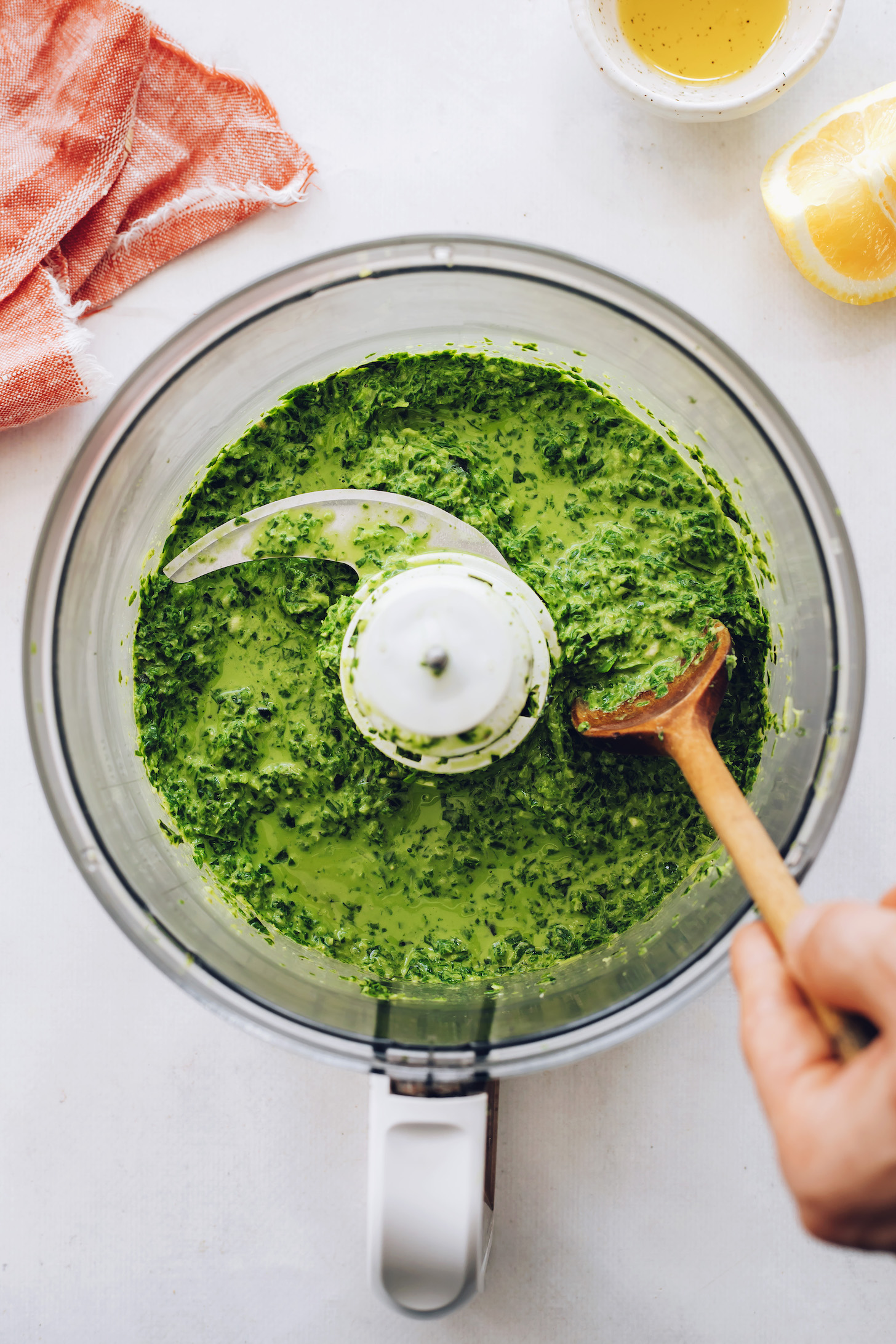 Food processor with a batch of easy vegan basil pesto