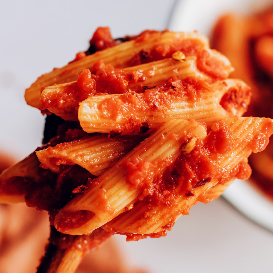 Close up shot of a bite of penne arrabbiata