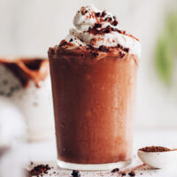 Vegan jamocha shake topped with coconut whipped cream
