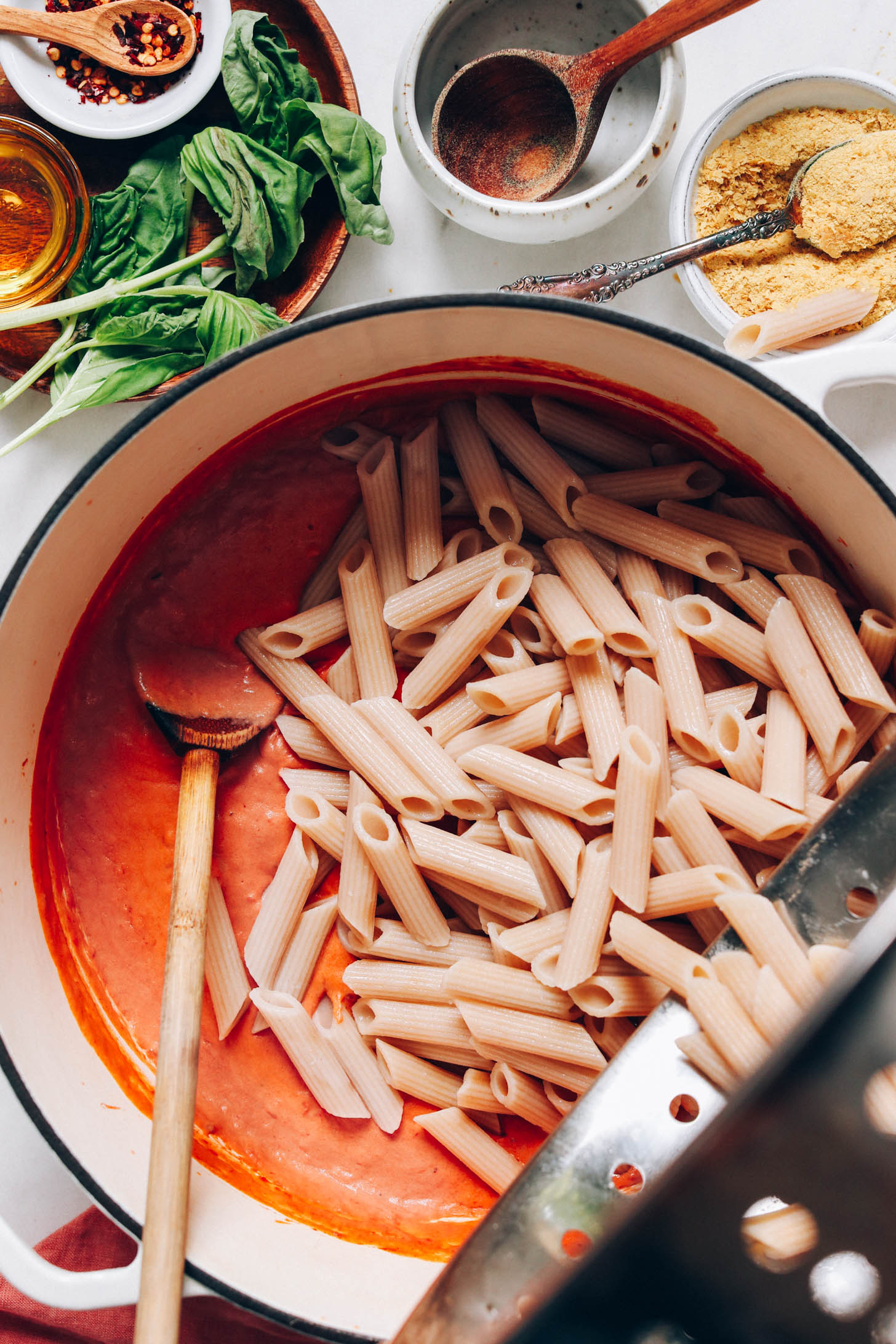 Adding penne noodles to vegan pink pasta sauce