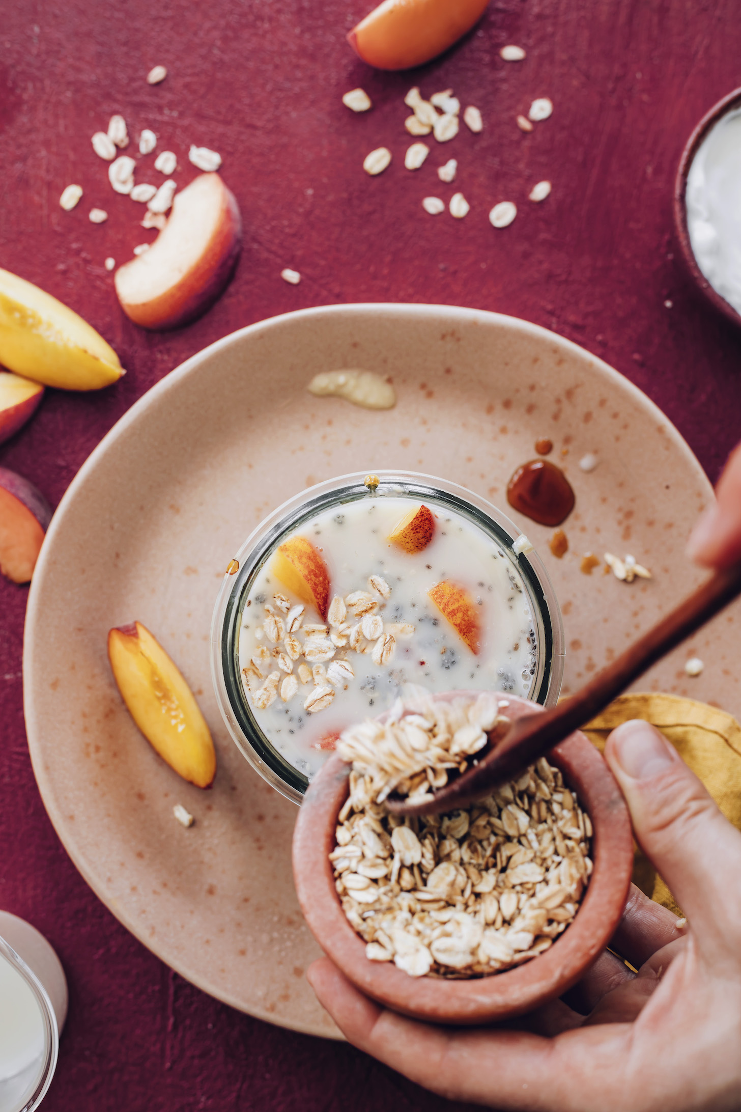 Pouring rolled oats into a jar