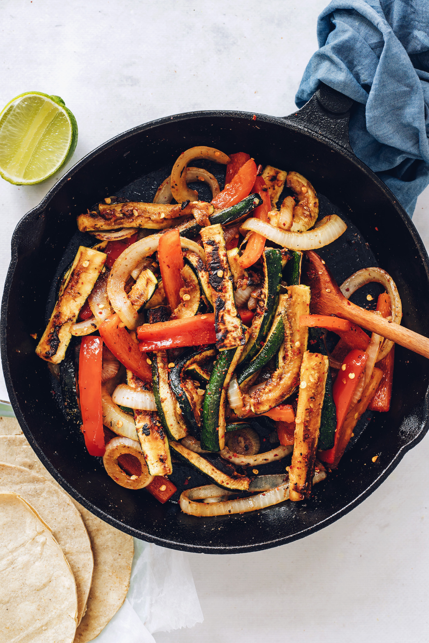Skillet of sautéed onions, bell pepper, and zucchini with spices