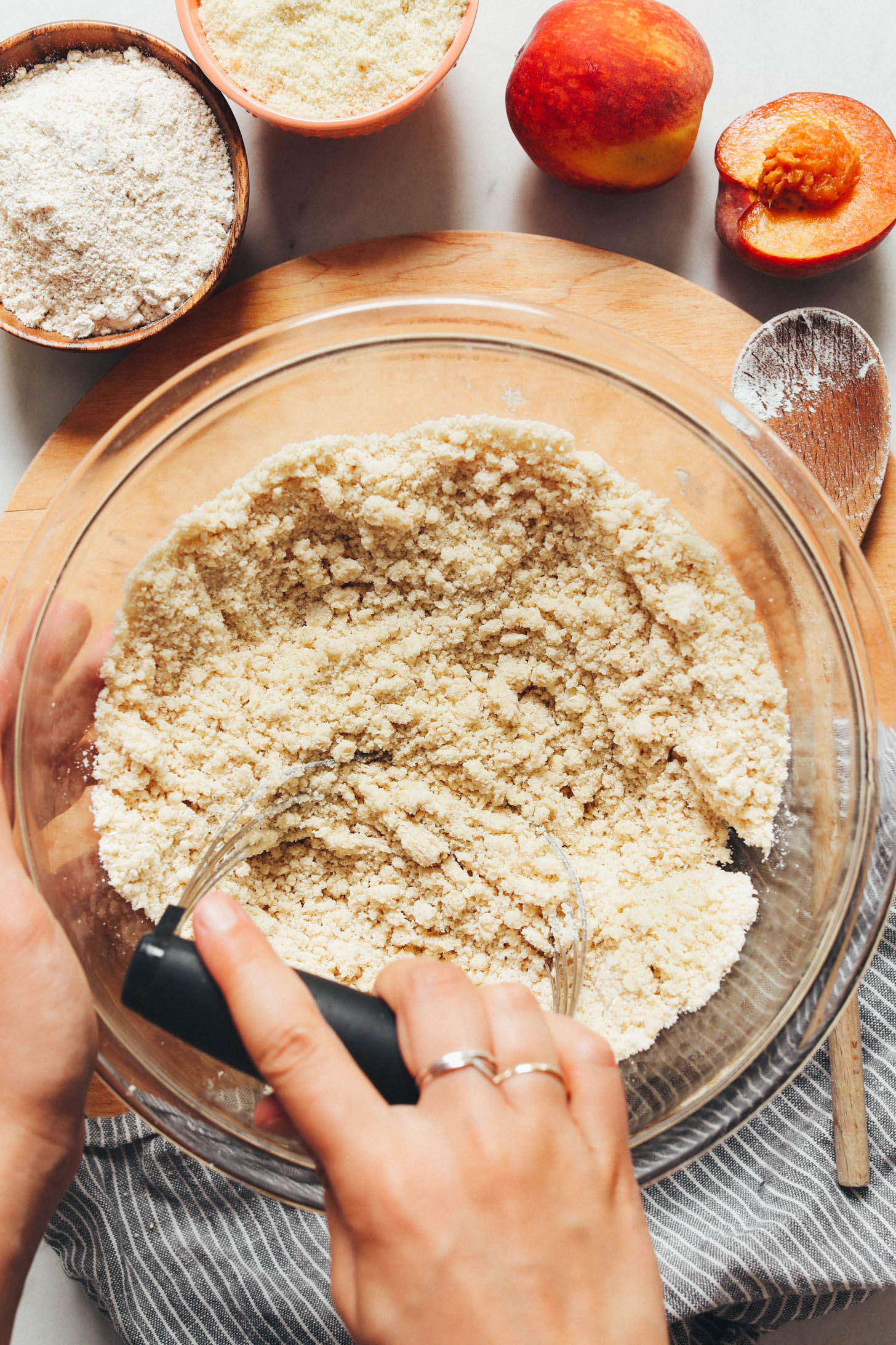 Using a pastry cutter to cut vegan butter into gluten-free flours
