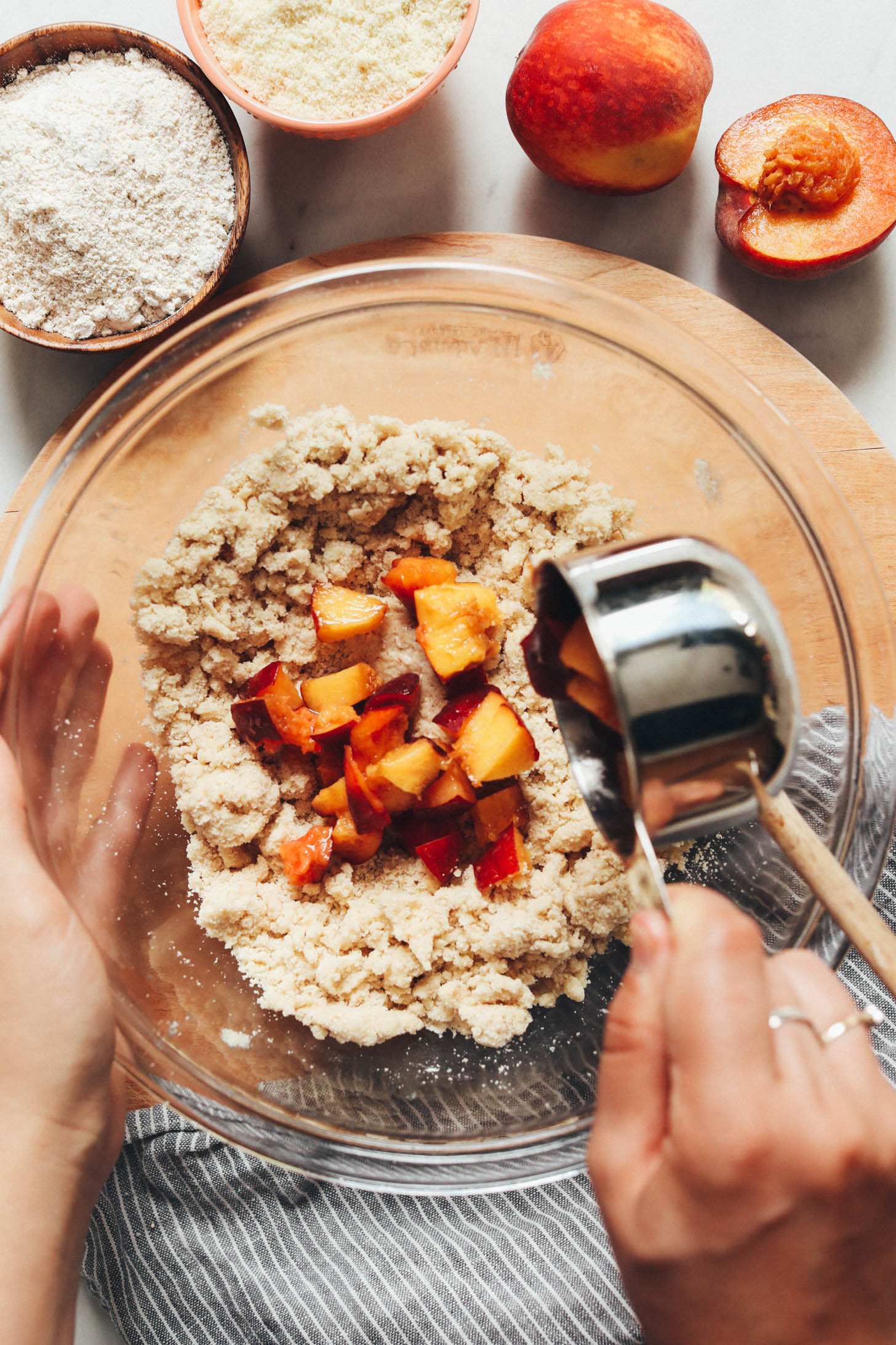 Adding chopped peaches to scone dough