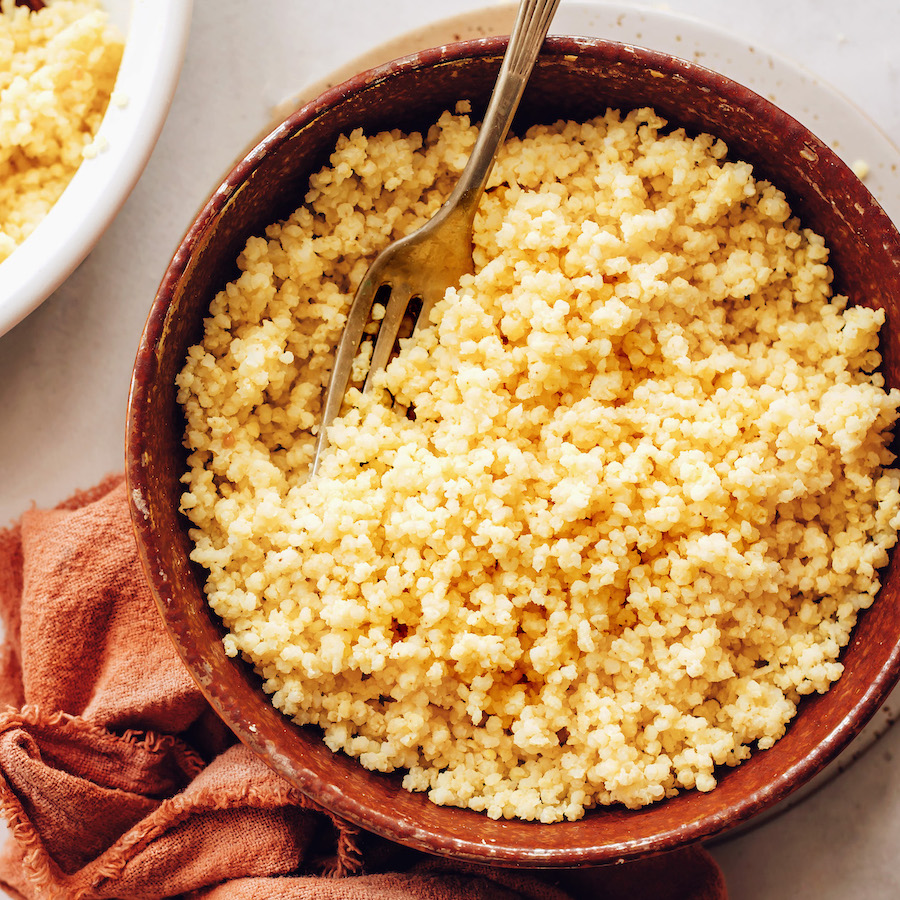 Fork in a bowl of cooked millet