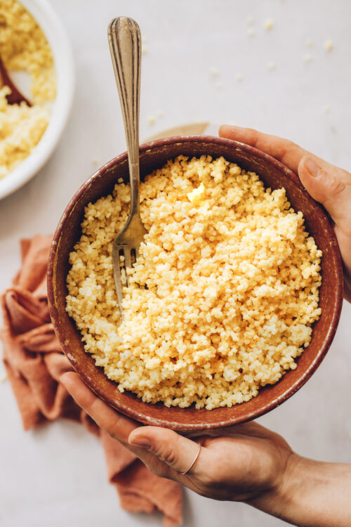 Fork in a bowl of cooked pearl millet