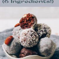 Bowl of vegan and gluten-free almond joy energy bites rolled in shredded coconut