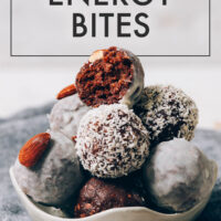 Bowl of vegan and gluten-free almond joy energy bites rolled in shredded coconut