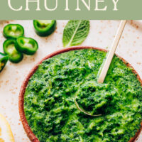 Bowl of vegan and gluten-free easy mint chutney with a spoon in it