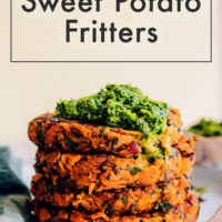Stack of vegan and gluten-free kale and sweet potato fritters with mint chutney on top