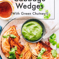 Plate of vegan and gluten-free shawarma roasted cabbage wedges with green chutney