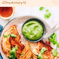 Plate of vegan and gluten-free shawarma roasted cabbage with green chutney