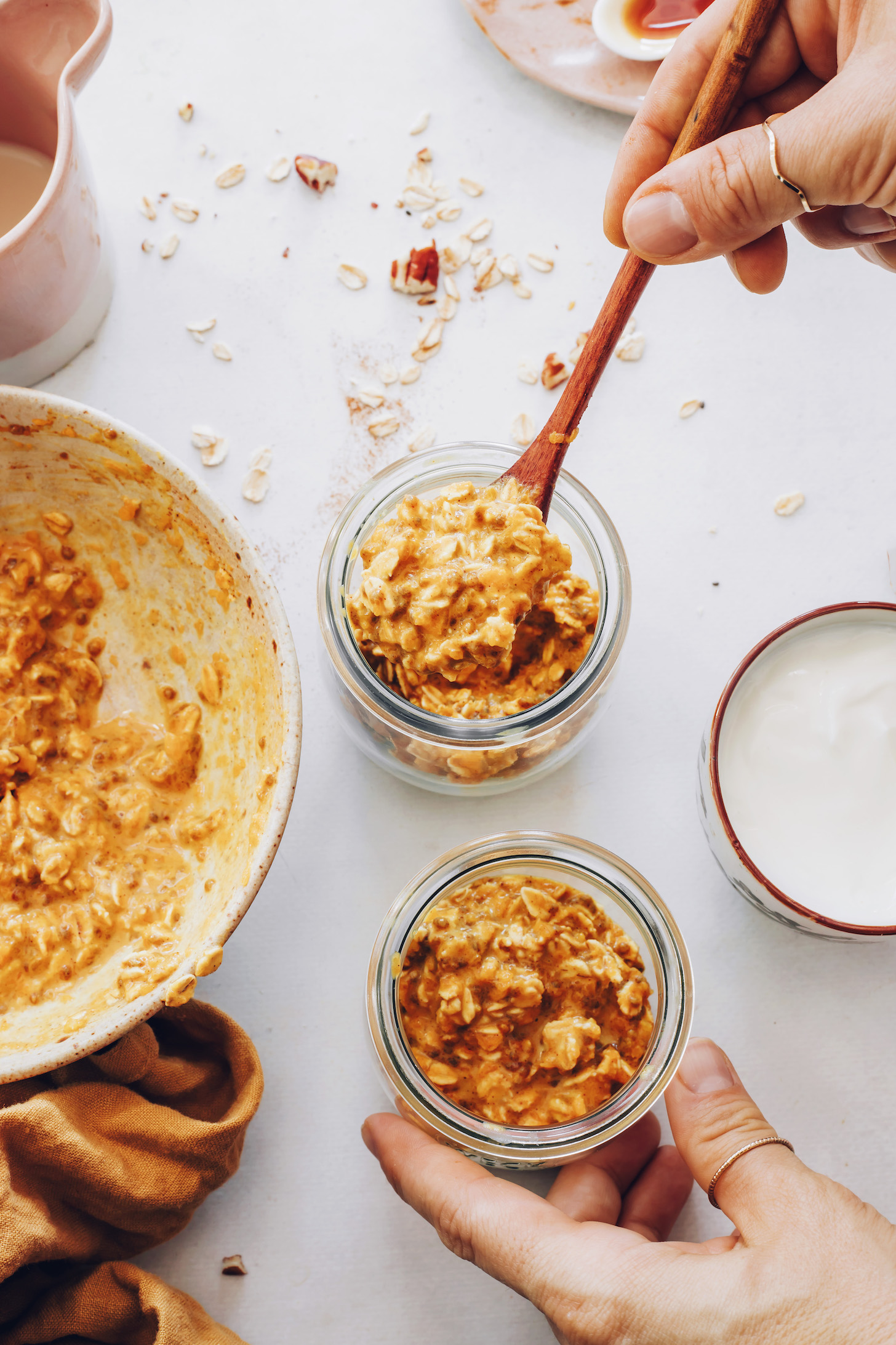 Bowl and jars of pumpkin overnight oats