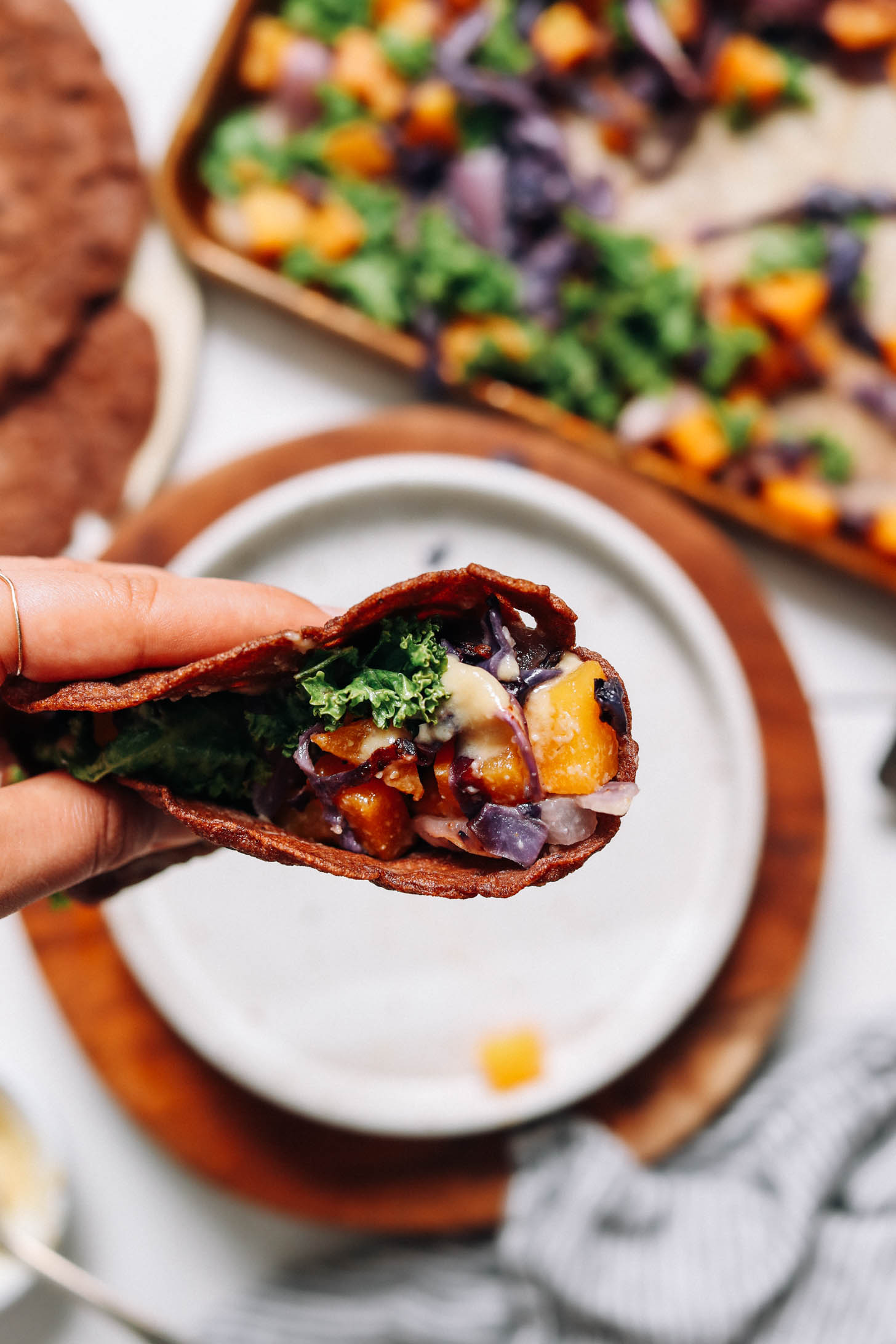 Close up shot of a savory teff crepe with miso roasted vegetables
