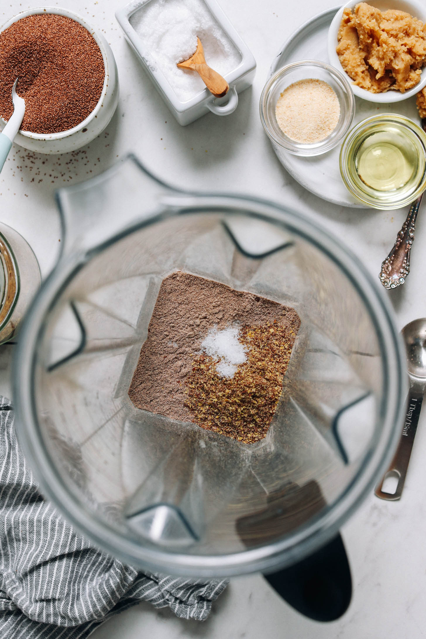 Teff flour, flaxseed meal, and salt in a blender