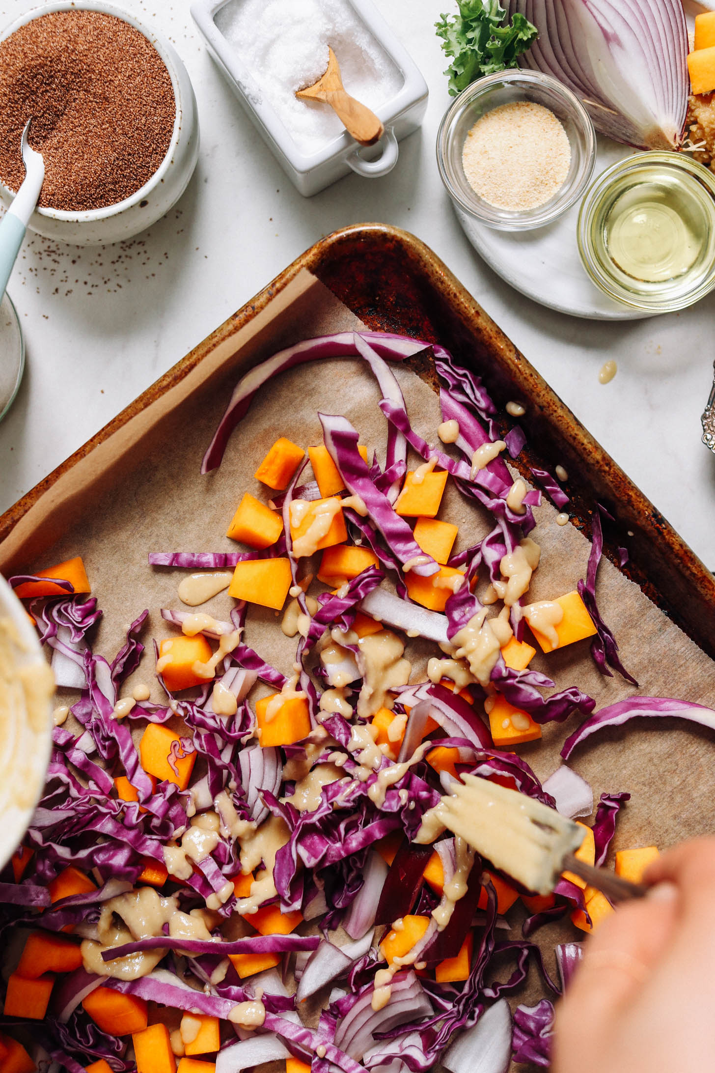 Drizzling cabbage, squash, and onions with miso sauce