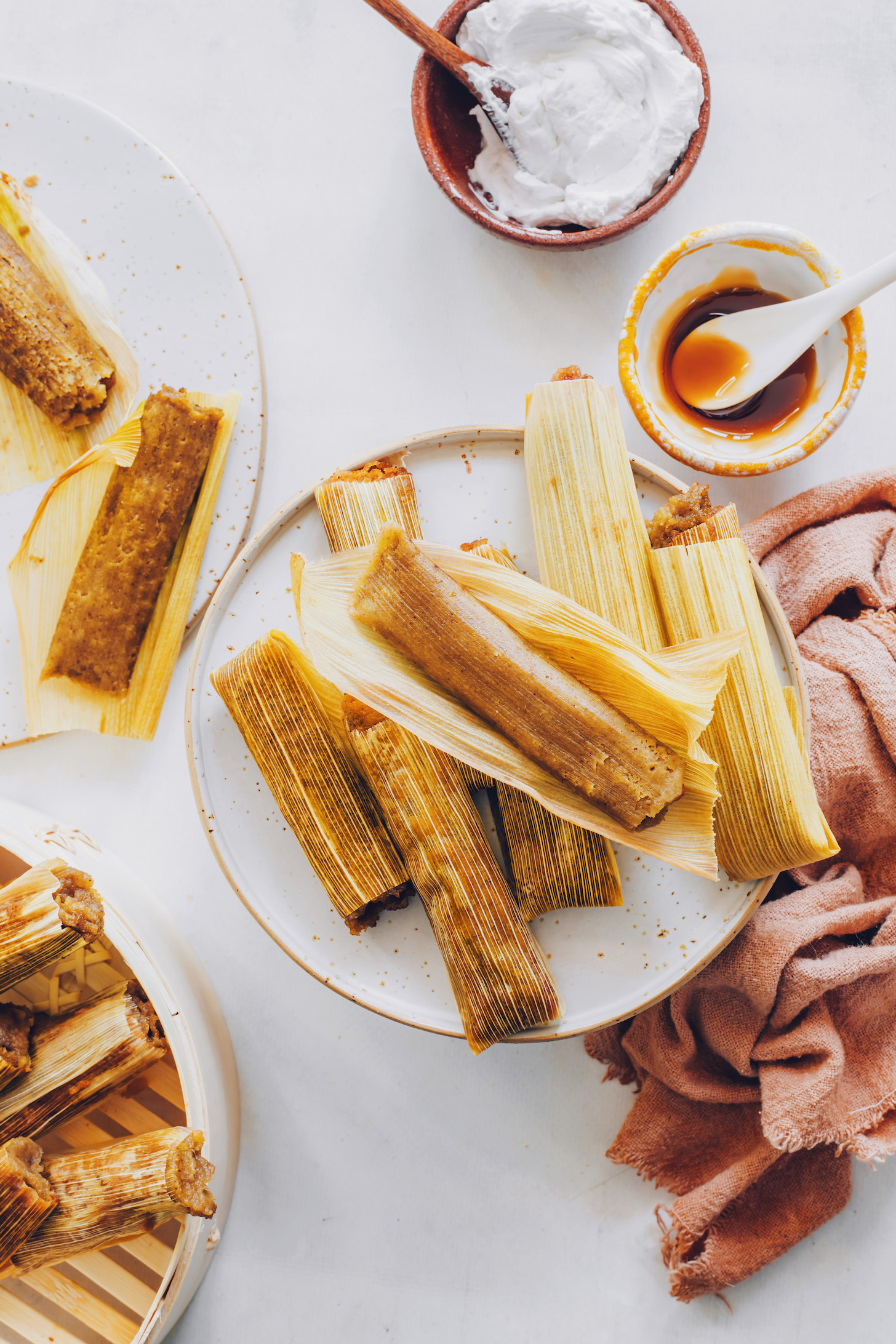 Plates of apple butter tamales in corn husks