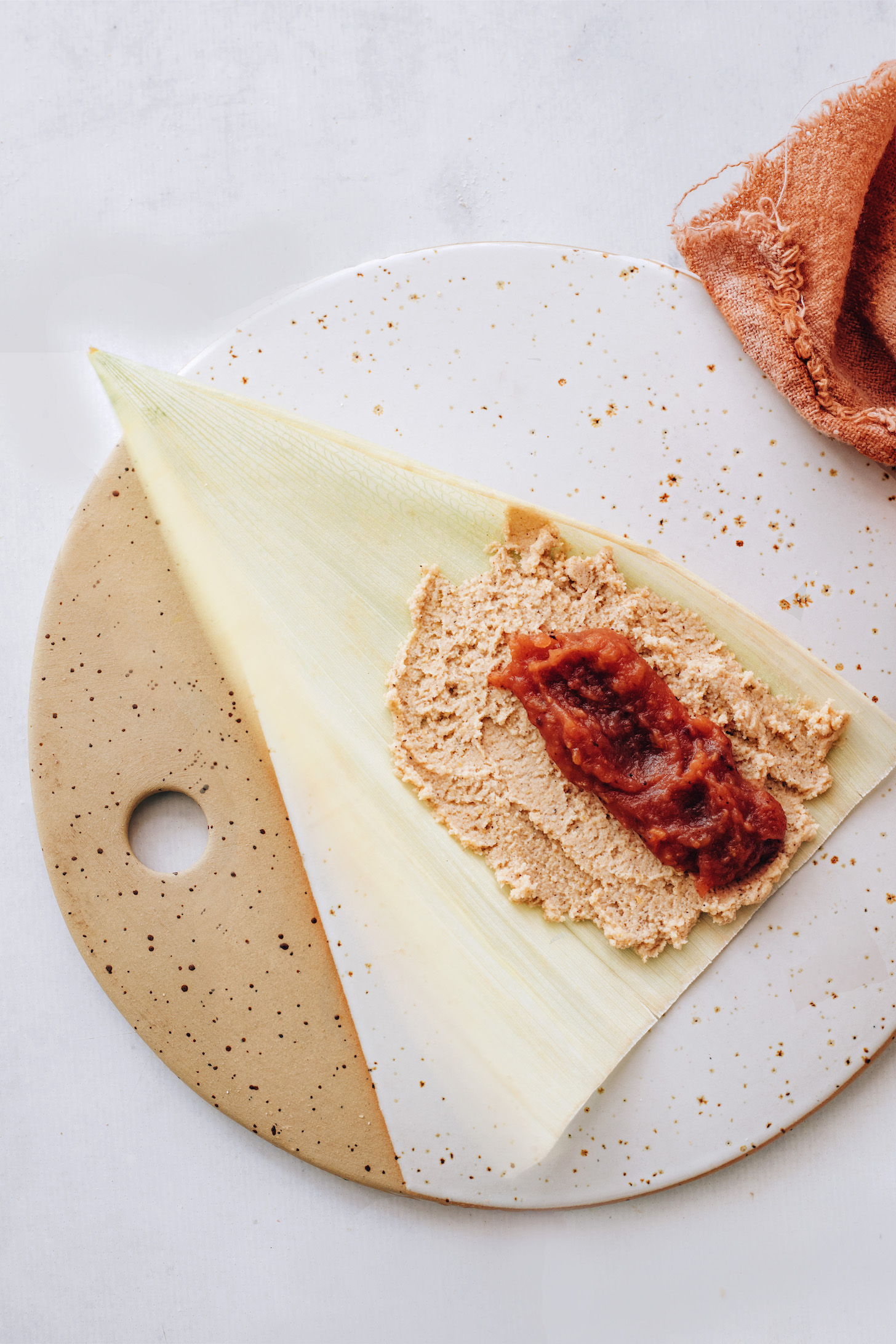 Masa dough and apple butter on a corn husk