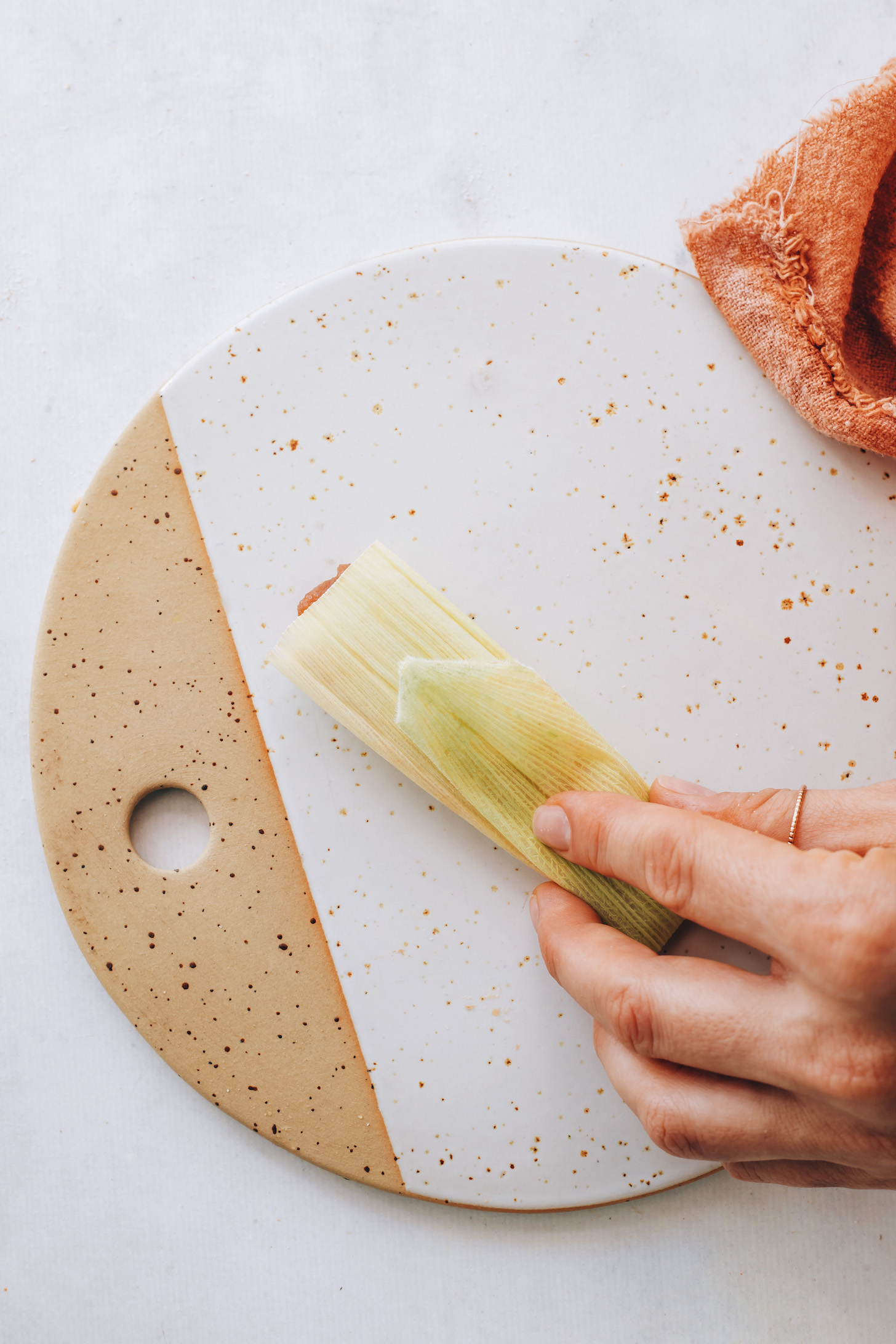 Showing a folded corn husk