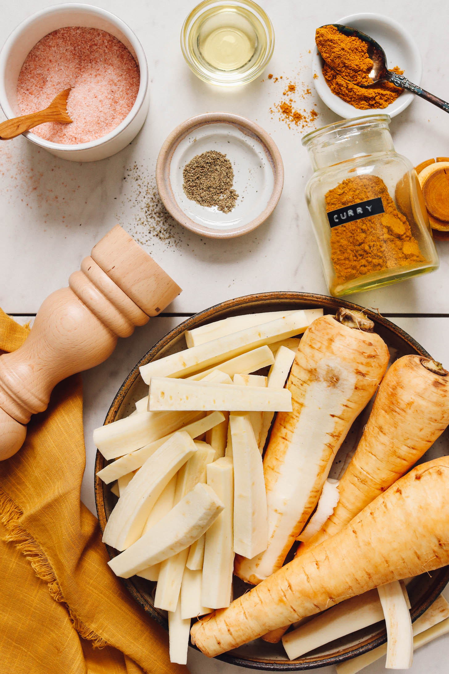 Parsnips, curry powder, salt, pepper, and avocado oil