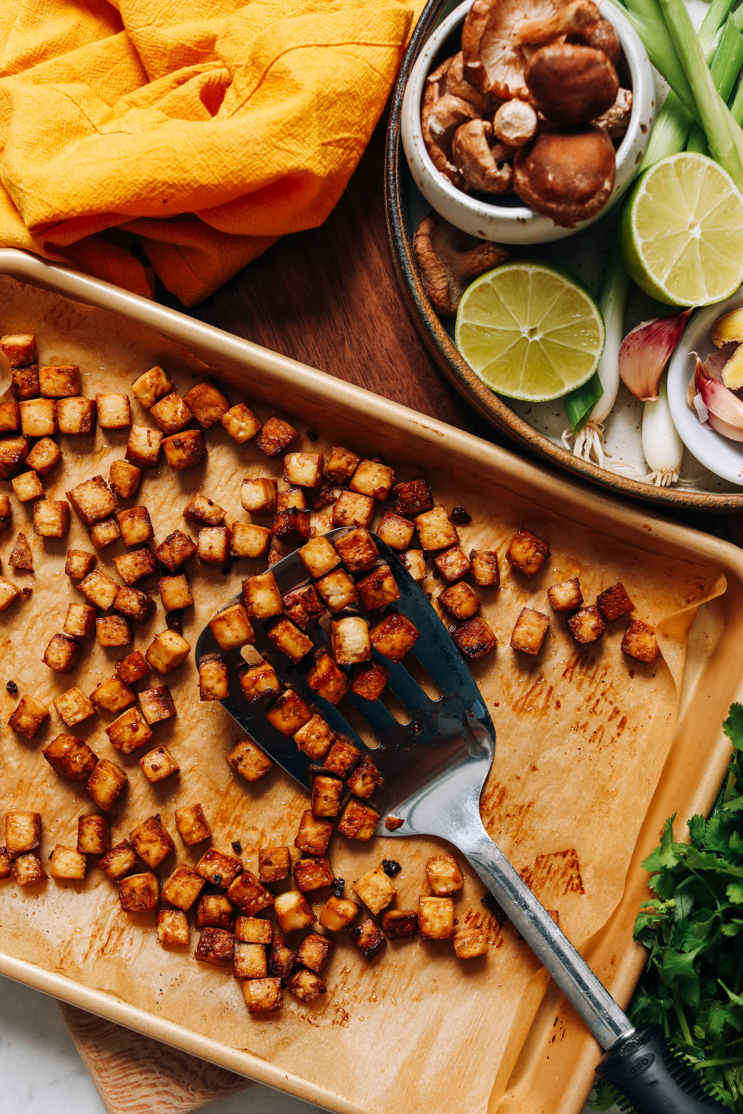 Crispy baked tofu cubes on a baking sheet