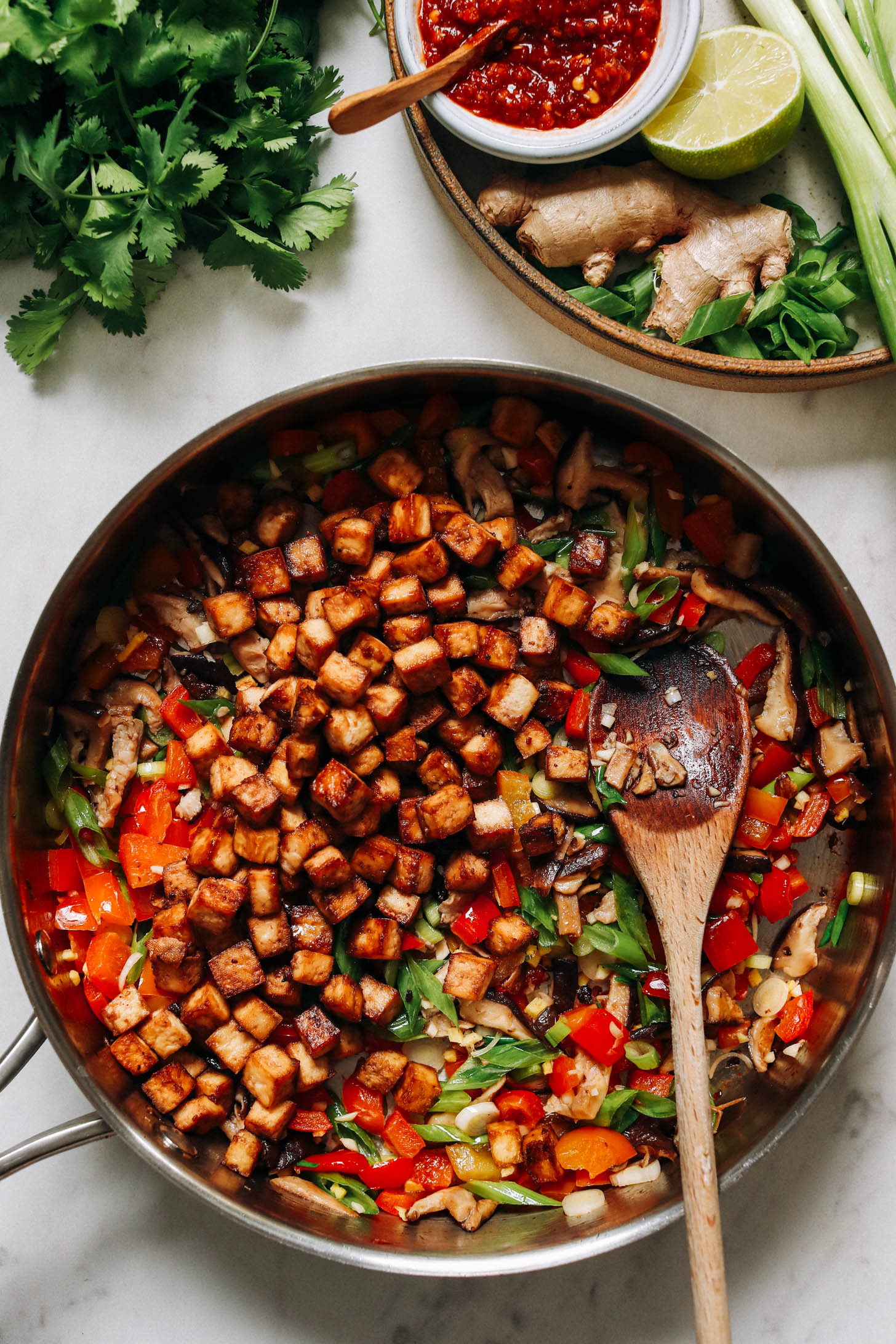 Pan of sautéed veggies and baked tofu