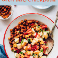 Bowl of vegan creamy summer salad with bbq chickpeas, with a bowl of bbq chickpeas on the side