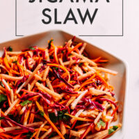 Bowl of vegan crunchy jicama slaw
