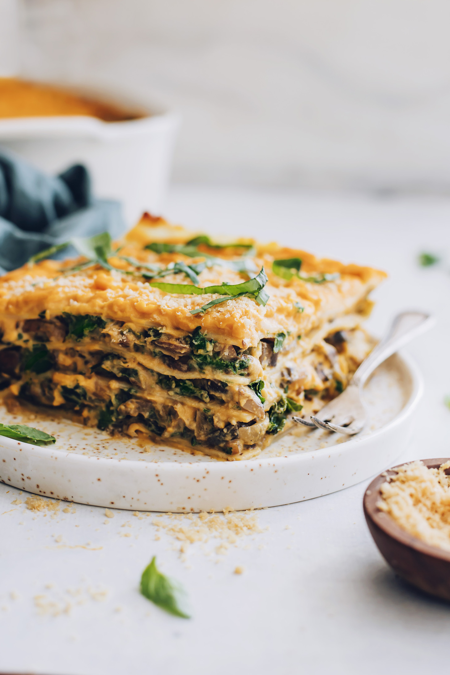 Fork and slice of butternut squash lasagna on a plate