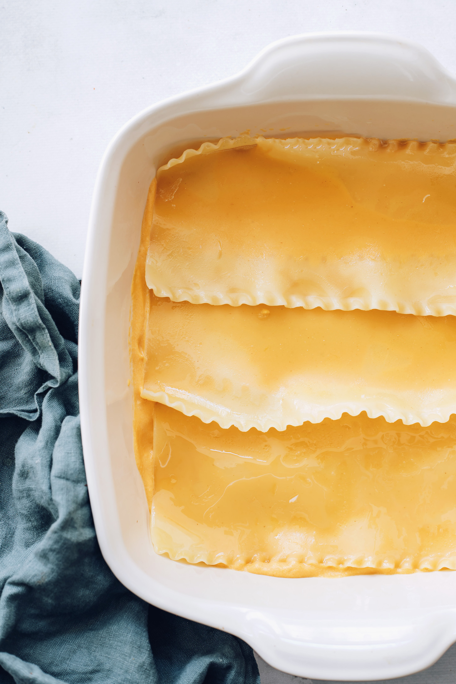 Butternut squash sauce topped with lasagna noodles