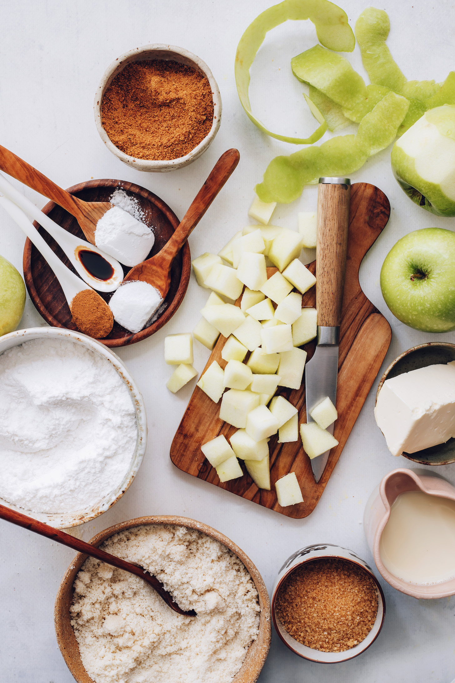 Coconut sugar, apples, vegan butter, dairy-free milk, cane sugar, almond flour, gluten-free flour blend, spices, baking powder, and baking soda