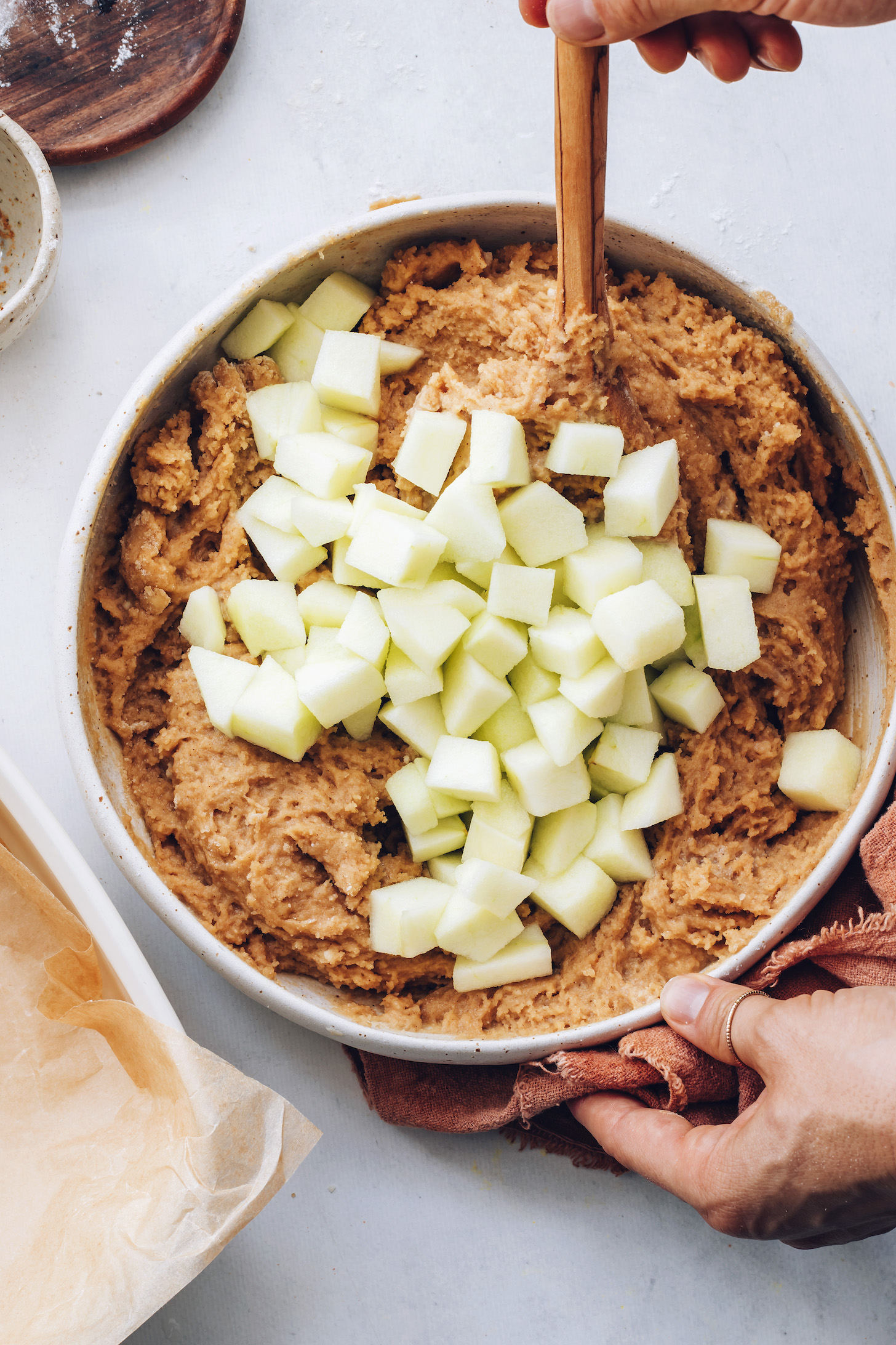 Stirring Granny smith apples into cake batter