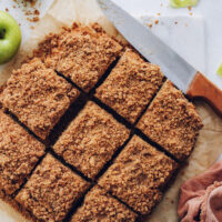 Overhead shot of slices of apple coffee cake with a crumb topping