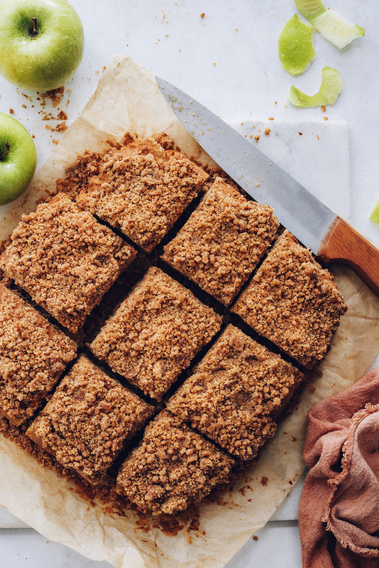 Overhead shot of slices of apple coffee cake with a crumble topping