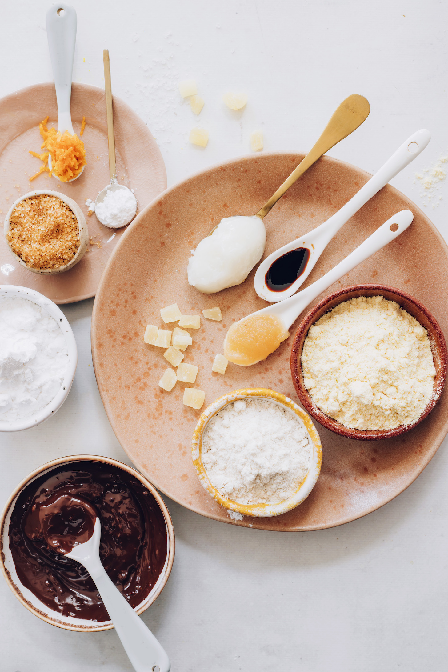 Gluten-free flours, melted chocolate, ginger, applesauce, vanilla, sugar, baking powder, orange zest, and coconut oil