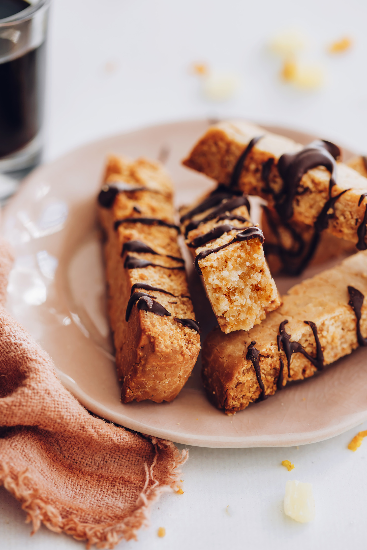Plate of gluten-free biscotti drizzled with chocolate