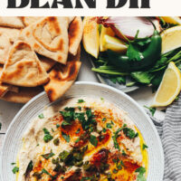 Bowl of our Charred Serrano White Bean Dip with text above it that says just 6 ingredients