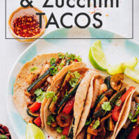 Plate of vegan and gluten-free bell pepper and zucchini tacos