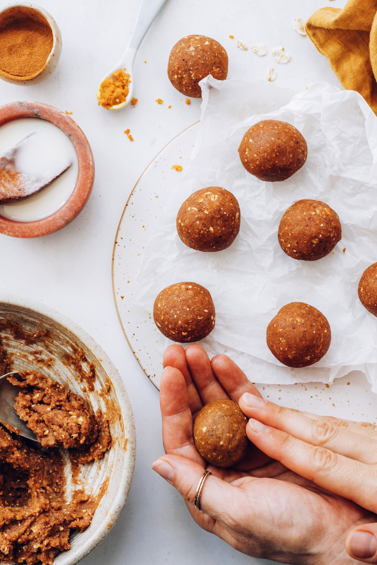 Rolling no-bake pumpkin spice dough into balls