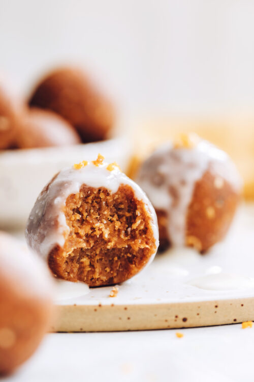 Close up shot of a pumpkin spice cake bite with coconut butter glaze